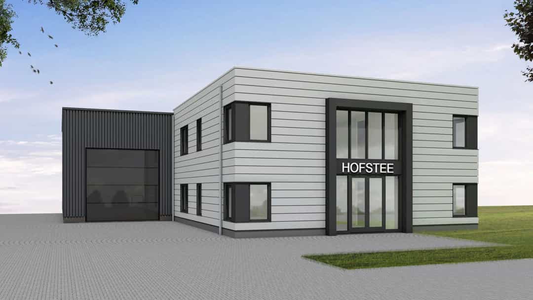 Moderne bedrijfspand Wolvega met grijze gevelafwerking, grote raampartijen, zwarte garage en ingangspartij met "HOFSTEE" opschrift