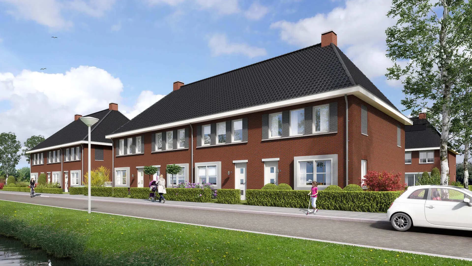 Nieuwbouw van 14 rijwoningen in Wolvega met karakteristieke jaren-dertig architectuur, metselwerk accenten, spekbanden en moderne bloemkozijnen.