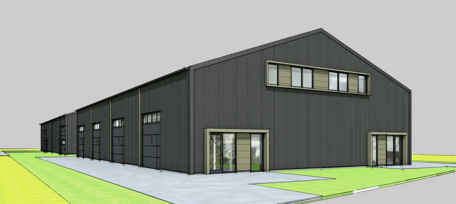 Bedrijfsverzamelgebouw in Steenwijk met donkere sandwichbeplating, bronzen gevelaccenten en betonnen plint.